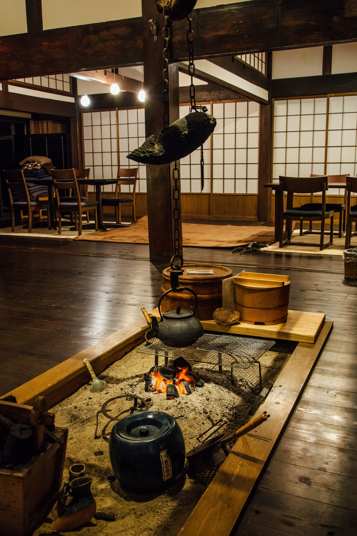 Communal, ground-floor lounge with traditional irori hearth