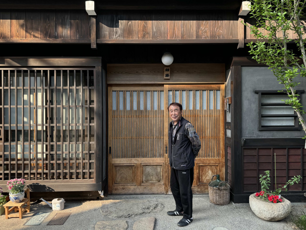 Mr. Kato in front of his house